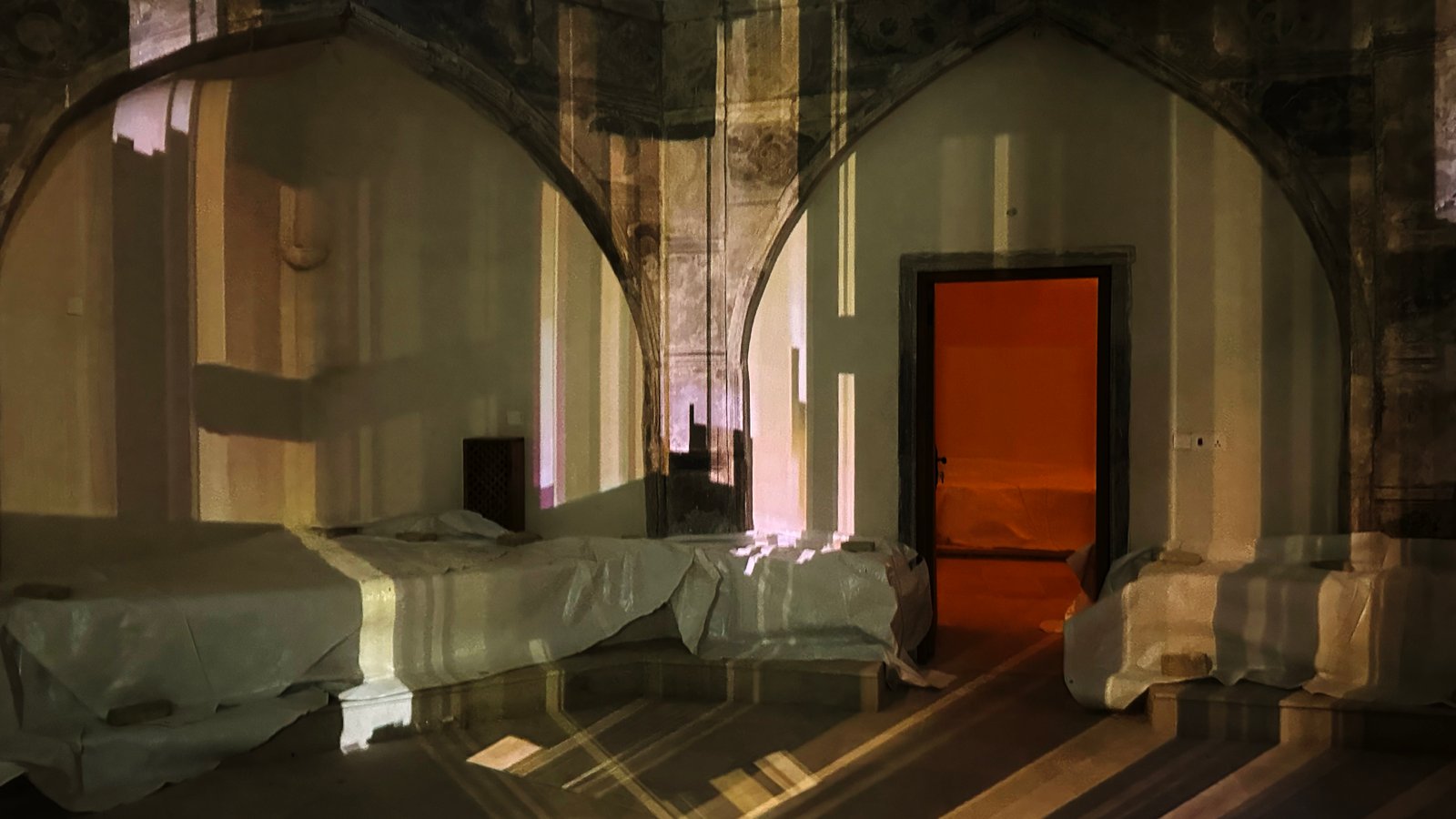 Projection mapping by VOID lit across an architectural surface